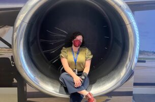 Garcia sitting in a jet engine