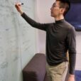 grant ho writing on white board