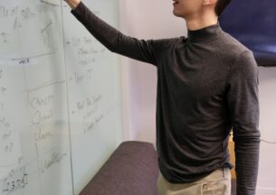 grant ho writing on white board