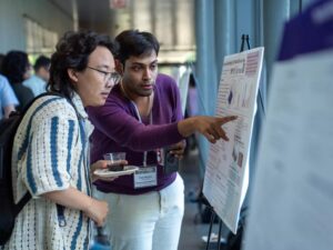students looking at poster